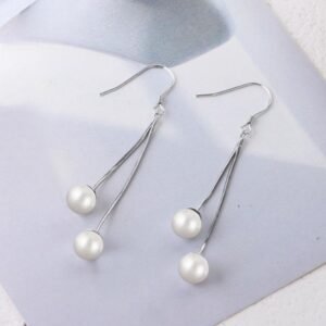 Silver ear hooks featuring Korean-style long pearl earrings, a stylish and unique accessory for women.