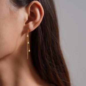 Silver ear hooks featuring Korean-style long pearl earrings, a stylish and unique accessory for women