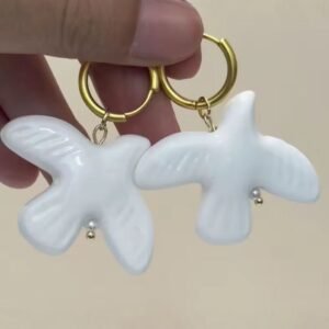 White ceramic and dove-shaped necklace with black string design for long coat chain accessories