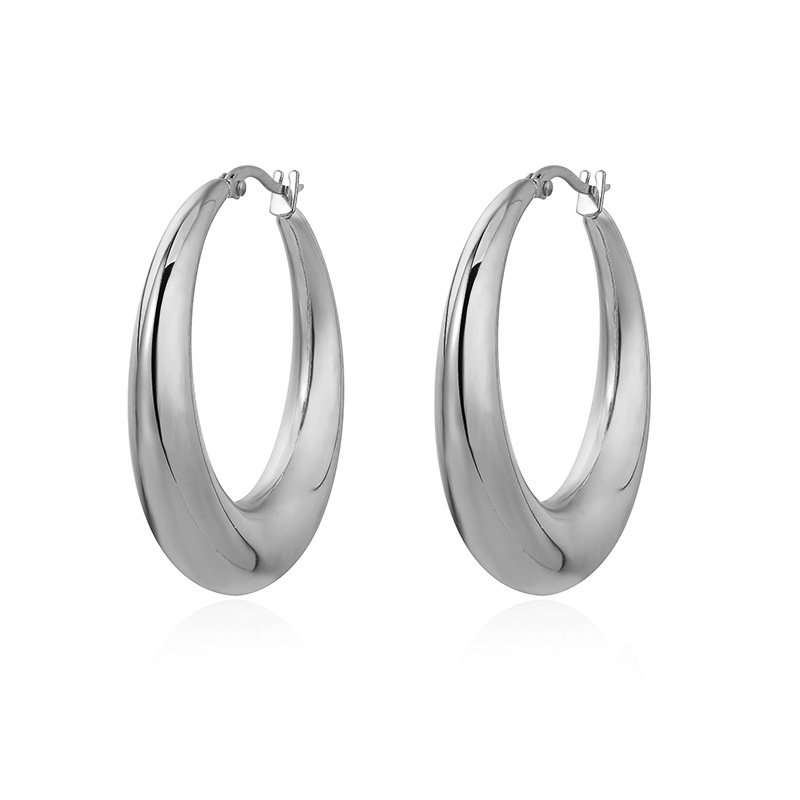 Metal round hoop earrings - elegant and simple, with a small and exclusive design touch. Luxurious and gold-colored accessory. - Image 3